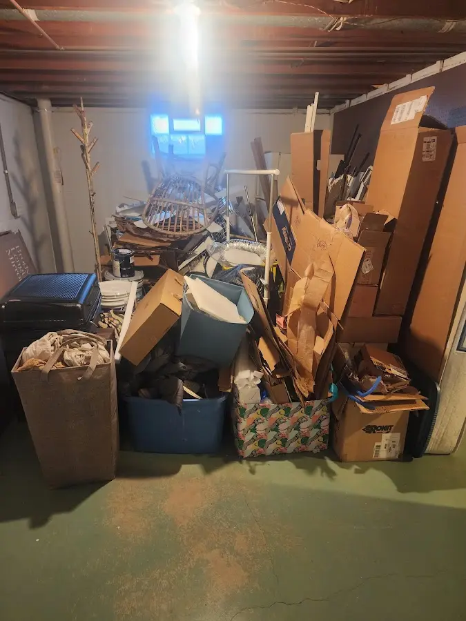 Roll-off dumpster container at job site for 6 Yard Dumpster Rental in Castleton